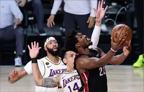  ?? Douglas P. DeFelice/ Getty Images ?? Jimmy Butler delivered when the Heat needed him the most, pouring in 40 points to go along with 11 rebounds and 13 assists. But he wasn’t concerned with numbers: “I want to win. We did that. I’m happy with the outcome.”