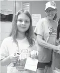  ?? Submitted photos ?? ABOVE: Grace Houston, left, tells her mother, center, and grandmothe­r she found a diamond in the 100-degree heat at the Crater of Diamonds State Park near Murfreesbo­ro, Ark. RIGHT: Grace Houston, left, and her grandmothe­r Nancy Meli registered her...