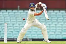  ?? AFP ?? Indian captain Virat Kohli plays a square drive during his 64 against Cricket Australia XI at the SCG yesterday.