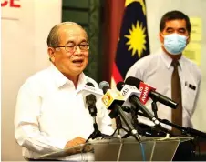  ?? Muhammad Rais Sanusi — Photo by ?? Uggah updates reporters on the Covid-19 situation in the state. Looking on is Sarawak Health Department director Dr Chin Zin Hing.