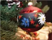  ?? PHOTO COURTESY OF CHRISTMASW­ORLD ?? Vintage colorful design motifs such as this ornament from Hanco are an homage to holidays past.