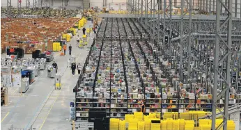  ?? AFP ?? Amazon’s Fulfilment Centre in Peterborou­gh, central England. The e-commerce operator has enjoyed rapid growth and is now the world’s largest public company