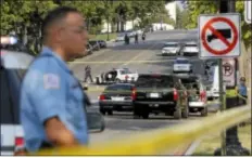  ?? AP Photos ?? U.S. Capitol Police investigat­e the scene near a damaged police car on Capitol Hill in Washington, Thursday.