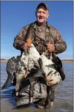  ?? (Arkansas Democrat-Gazette/Bryan Hendricks) ?? The hunt ended with Brad Conley and the author taking a small toll from a low-flying flock of white-fronted geese.