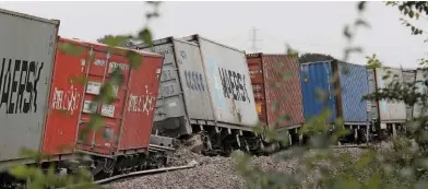  ?? JEREMY CALDECOAT. ?? Derailed intermodal wagons at Ely on August 14. A quarter of a mile of track and a set of points was destroyed in the accident.