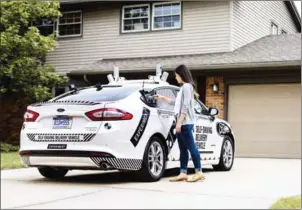  ?? YORK TIMES FORD MOTOR COMPANY VIA THE NEW ?? A self-driving Ford Fusion. The Domino’s pizza chain plans to start testing deliveries using a self-driving Fusion outfitted with enough sensors, electronic­s and software to find its way to customers’ homes or offices in Ann Arbor, Michigan.