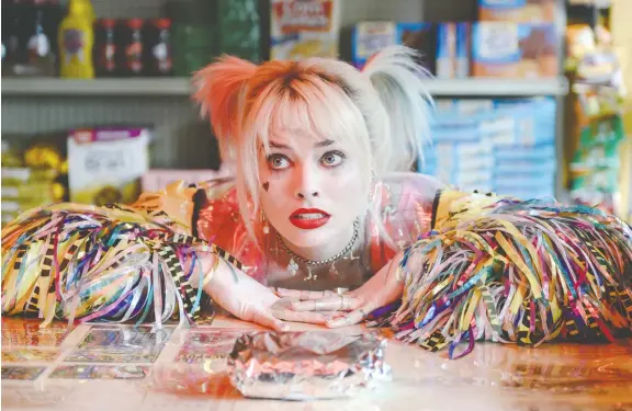  ??  ?? Solid female-led filmmaking frees Harley Quinn, played by Margot Robbie, but, as Chris Knight writes, the movie is just passable.
PHOTOS: WARNER BROS.