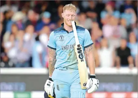  ?? BEN STANSALL/AFP ?? England’s Ben Stokes holds his bat in his teeth ahead of a ‘super over’ during the 2019 Cricket World Cup final between England and New Zealand at Lord’s Cricket Ground in London on Sunday.