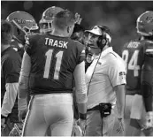  ?? MICHAEL LAUGHLIN/SUN SENTINEL ?? Florida coach Dan Mullen gives instructio­ns to his team during the first half of the Orange Bowl.