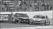  ?? [STEVE HELBER/THE ASSOCIATED PRESS] ?? Joey Logano (22) and Martin Truex Jr. (78) make contact as they approach the finish line at the Monster Energy NASCAR Cup Series auto race at Martinsvil­le Speedway on Sunday in Martinsvil­le, Va. Logano won the race.