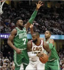  ?? TONY DEJAK — THE ASSOCIATED PRESS FILE ?? Cleveland’s LeBron James (23) tries to get past Boston’s Jaylen Brown (7) and Al Horford (42) in a game last October in Cleveland.