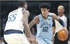  ?? Ron Jenkins Associated Press ?? MEMPHIS GUARD Ja Morant is the early favorite for rookie of the year, with the Grizzlies in the middle of a quick rebuilding process.