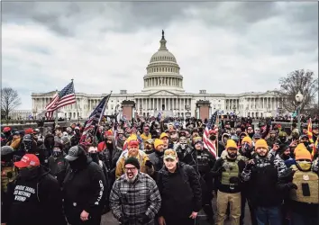  ?? Jon Cherry / Getty Images / Tribune News Service ?? Pro-Trump protesters gather in front of the U.S. Capitol in Washington, D.C., on Wednesday. A pro-Trump mob stormed the Capitol, breaking windows and clashing with police officers.