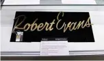  ??  ?? Robert Evans’s name for his Paramount Studios office door is displayed during an auction preview of “Property from the Estate of Robert Evans”.