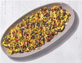  ?? TOM MCCORKLE/THE WASHINGTON POST ?? Roasted delicata squash slices replace the chips in a different take on nachos. Instead of the cashew sauce you can top these with pepper jack cheese.