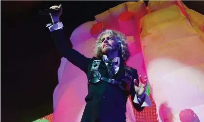  ?? Photograph: Jim Dyson/Getty Images ?? Off-centre stage … Wayne Coyne performing with the Flaming Lips in May.