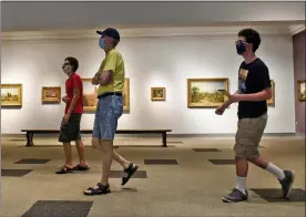  ?? BEN HASTY — MEDIANEWS GROUP ?? In June, from left, Ben Hasselbach, 15, Randy Newnham, and John Newnham at the Reading Public Museum. The museum opened to small groups in the yellow phase in early summer, and later to the public. But its tent on the grounds has been central site for activities.