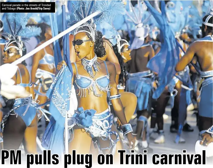  ?? (Photo: Jon Arnold/trip Savvy) ?? Carnival parade in the streets of Trinidad and Tobago