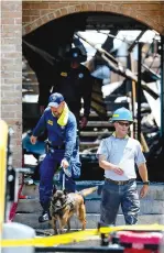  ?? Marvin Pfeiffer/
The San Antonio Express-News via AP
Jerry Lara/The San Antonio Express-News via AP Marvin Pfeiffer/
The San Antonio Express-News via AP ?? aboveInves­tigators walk through an entryway Monday at the Iconic Village Apartments in San Marcos, Texas. Five victims have been recovered so far from the fire that began Friday at the apartment complex at 4:30 a.m. and affected three apartment buildings. above, middleEmer­gency personnel investigat­e the scene of a fire Sunday at the Iconic Village Apartments. The fire affected about 200 residents. above, rightFire officials are lowered in a basket by a crane outside Building 500 on Monday at the apartment complex.