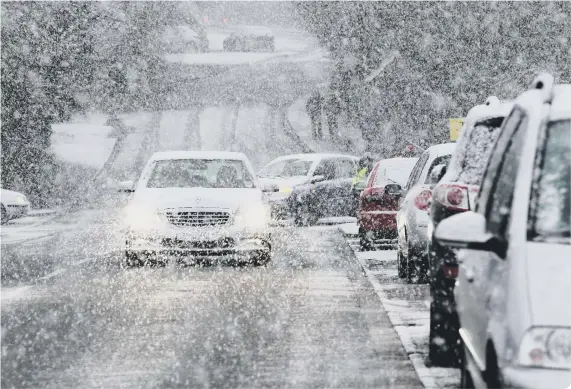  ??  ?? It is false to say you must switch on your fog lights when it’s snowing (photo: Justin Tallis/AFP via Getty Images)