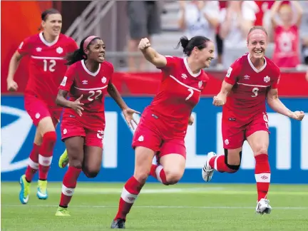  ?? DARRYL DYCK/THE CANADIAN PRESS ?? From left, Canada’s Christine Sinclair, Ashley Lawrence, Rhian Wilkinson and Josée Bélanger celebrate Bélanger’s goal against Switzerlan­d during the second half of the FIFA Women’s World Cup round of 16 match Sunday in Vancouver. Canada won 1-0.