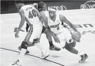  ?? JIM RASSOL/STAFF FILE PHOTO ?? Udonis Haslem, left, and LeBron James, right, rank as the No.3 and No.1 free-agent signings by the Miami Heat.