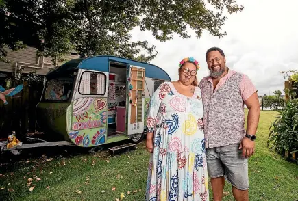  ?? ABIGAIL DOUGHERTY/STUFF ?? Husband and wife creative team Lissy and Rudi Robinson-Cole in their garden at O¯ ta¯huhu, Auckland. Ta¯maki Estuary is just behind them.