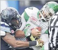  ?? AP PHOTO ?? Toronto Argonauts defensive lineman Shawn Lemon sacks Saskatchew­an Roughrider­s quarterbac­k Brandon Bridge during CFL East Division final at BMO Field in Toronto on Nov. 19, 2017.