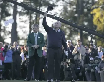  ?? Chris Carlson/Associated Press ?? Jack Nicklaus looks up to the sky to honor Arnold Palmer before hitting an honorary first tee shot Thursday for the traditiona­l start of the Masters in Augusta, Ga.