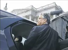  ?? Jacquelyn Martin/Associated Press ?? Sen. Al Franken, D-Minn., leaves the Capitol after speaking on the Senate floor Thursday in Washington. Mr. Franken said he will resign from the Senate in coming weeks following a wave of sexual misconduct allegation­s.