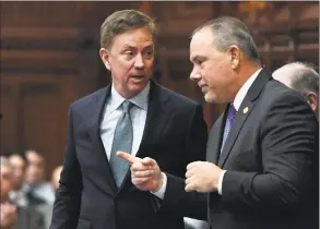  ?? Jessica Hill / Associated Press file photo ?? Gov. Ned Lamont talks with Speaker of the House Joe Aresimowic­z at the State Capitol in February.