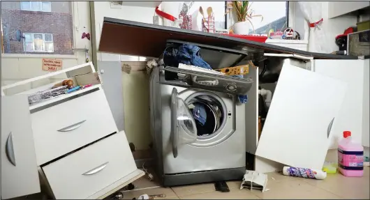  ??  ?? Lucky escape: Simon and Zara Bettridge’s kitchen after their washing machine exploded while they and their three children were out
