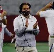  ?? AP PHOTO BY RON JENKINS ?? Alabama head coach Nick Saban applauds as he watches his team play Notre Dame late in the second half of the Rose Bowl NCAA college football game in Arlington, Texas, Friday, Jan. 1.