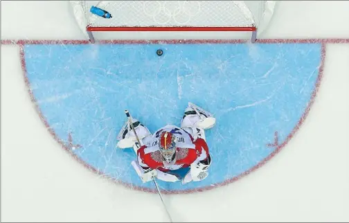  ?? MARK BLINCH / REUTERS ?? Russia’s goalie, Sergei Bobrovsky, reacts after giving up the game-winning goal to Team USA’s T.J. Oshie (not seen) during the shootout in their preliminar­y-round ice hockey game at the Sochi Winter Olympics on Saturday.