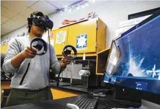  ?? Eli Hartman / Odessa American ?? New Tech senior Octavio Garcia, 17, demonstrat­es how the high school’s students use a program called SyGlass and virtual reality in the neuroscien­ce program Tuesday afternoon in Odessa.