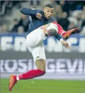  ?? Daniel Cole Associated Press ?? KYLIAN MBAPPE, competing last month in Nice, France, is a brilliant passer who sets up teammates.
