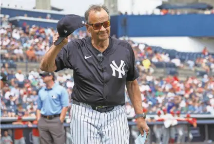  ?? NATHAN RAY SEEBECK/USA TODAY SPORTS ?? Former Yankees manager Joe Torre brings out the lineup card for a spring training game on March 18. Twenty-five years earlier, Torre got a standing ovation before a game at Fenway Park.