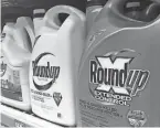  ?? HAVEN DALEY/AP FILE ?? Pharmaceut­ical giant Bayer is facing thousands of claims from people who say exposure to weed killer Roundup caused their cancer.