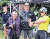  ?? PHOTO: YVONNE O’HARA ?? Champagne celebratio­n . . . Kath Kelly celebrates the final lap of her Everesting Challenge with her mother Rosemary Kelly, of Roxburgh, niece Hannah Kelly, of Blenheim, and brother Tom Kelly, of Blenheim.