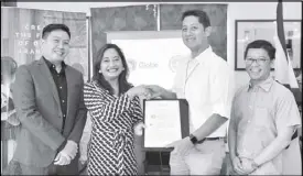  ??  ?? Michelle Tapia, head of strategy, innovation, and transforma­tion of Globe myBusiness and Br. Dennis Magbanua, FSC, president of De La Salle-College of Saint Benilde show the MOA for a three -year research grant. Together with them are Derrick Heng,...