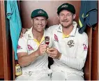  ?? RYAN PIERSE/ GETTY IMAGES ?? Australian cricketers David Warner and Cameron Bancroft celebrate their Ashes test series victory over England.