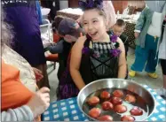  ?? SUBMITTED PHOTO ?? Skylar Gilboy bobbing for apples in Westmorela­nd at last year’s Haunted Schoolhous­e
