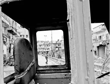  ??  ?? A picture shows a view of damaged buildings in the Syrian city of Raqa. — AFP photo