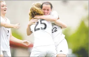  ?? Jason Ivester/NWA Democrat-Gazette ?? Siloam Springs junior Audrey Maxwell hugs junior Megan Hutto, No. 25, after scoring off an assist from Hutto Friday against Russellvil­le at Razorback Field in Fayettevil­le during the 6A state championsh­ip game. Also pictured is Sydney Bomstad, who also scored a goal in the state finals.