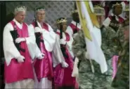  ?? JACQUELINE LARMA — THE ASSOCIATED PRESS ?? Men wear crowns and hold unloaded weapons at the World Peace and Unificatio­n Sanctuary on Wednesday in Newfoundla­nd, Pa.