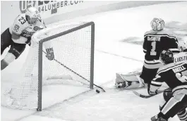  ?? GENE J. PUSKAR AP ?? Carter Verhaeghe scores his second goal of the game Tuesday late in the third period to tie the score and force overtime for the Panthers at Pittsburgh.