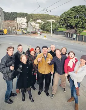  ?? Photo: FAIRFAX NZ ?? Members of opposition group Save the Basin and others celebrate outside the Basin Reserve after the decision to reject resource consent. Their lawyer argued yesterday that the Transport Agency continued to believe it was right despite evidence to the contrary.