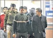  ?? ANI ?? Police escort Aaftab Poonawala (masked) out of Delhi’s Forensic Science Laboratory after he took a polygraph test on Thursday.