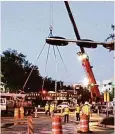  ?? Courtesy ?? The first of four iconic Post Oak Boulevard stainless steel rings in Uptown Houston was temporaril­y removed to widen the new boulevard.