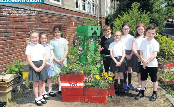  ??  ?? Colourful creation The children of West Primary School with their Minecraft-inspired mini garden